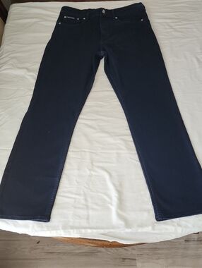 Calvin Klein black syretch jeans with tan logo patch